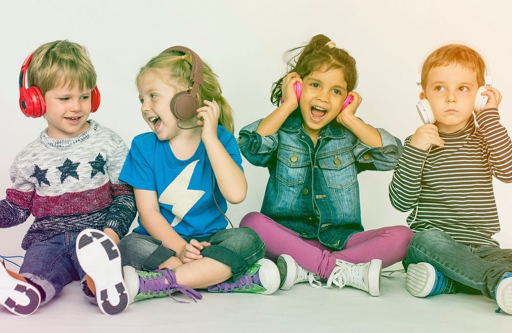 Group of kids listening music with headphone