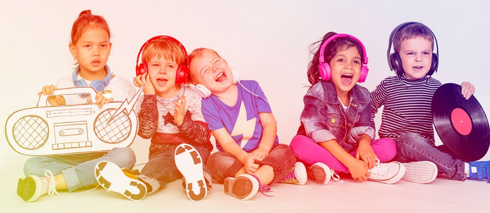 Group of kids smiling having fun and listening music