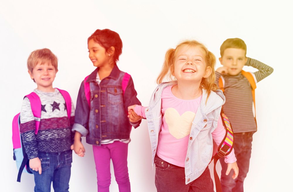 Group of kids holding hands and smiling happiness