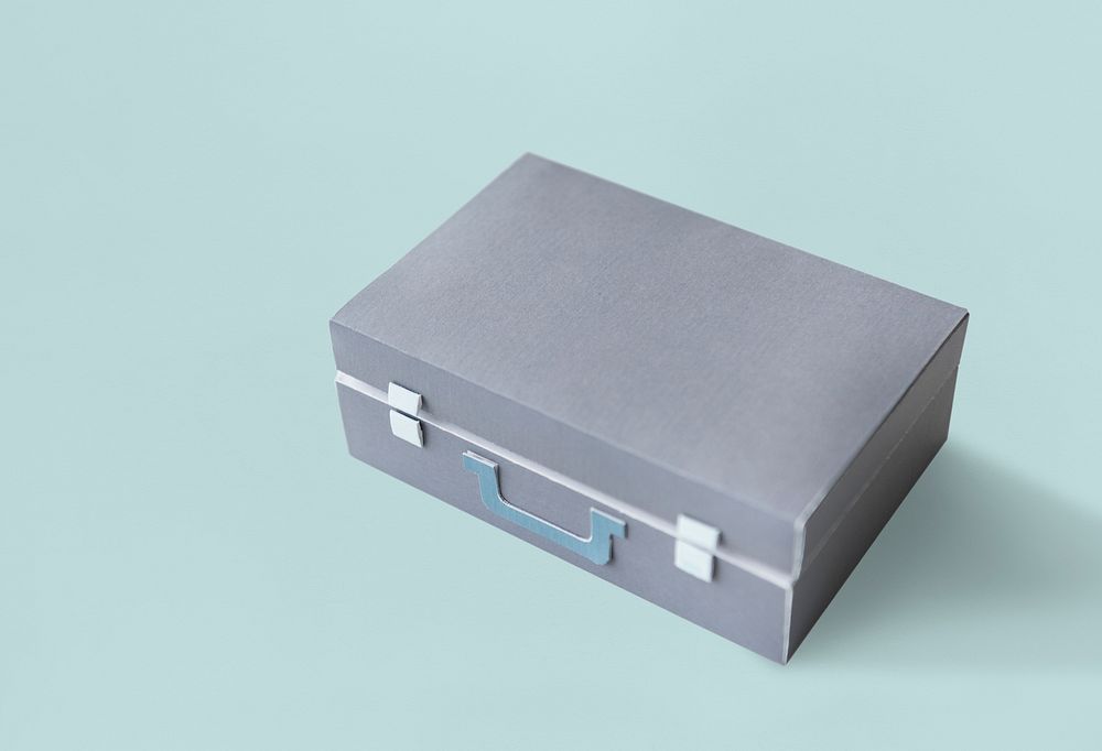 Closed Suitcase in Grey with Green Handle Isolated