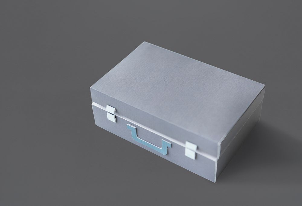 Closed Suitcase in Grey with Green Handle Isolated