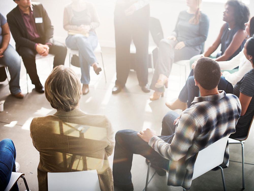 Group of people seated in a circle