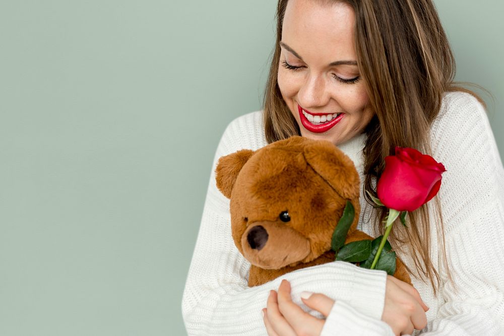 Young Lady Hugging Teddy Rose Smiling