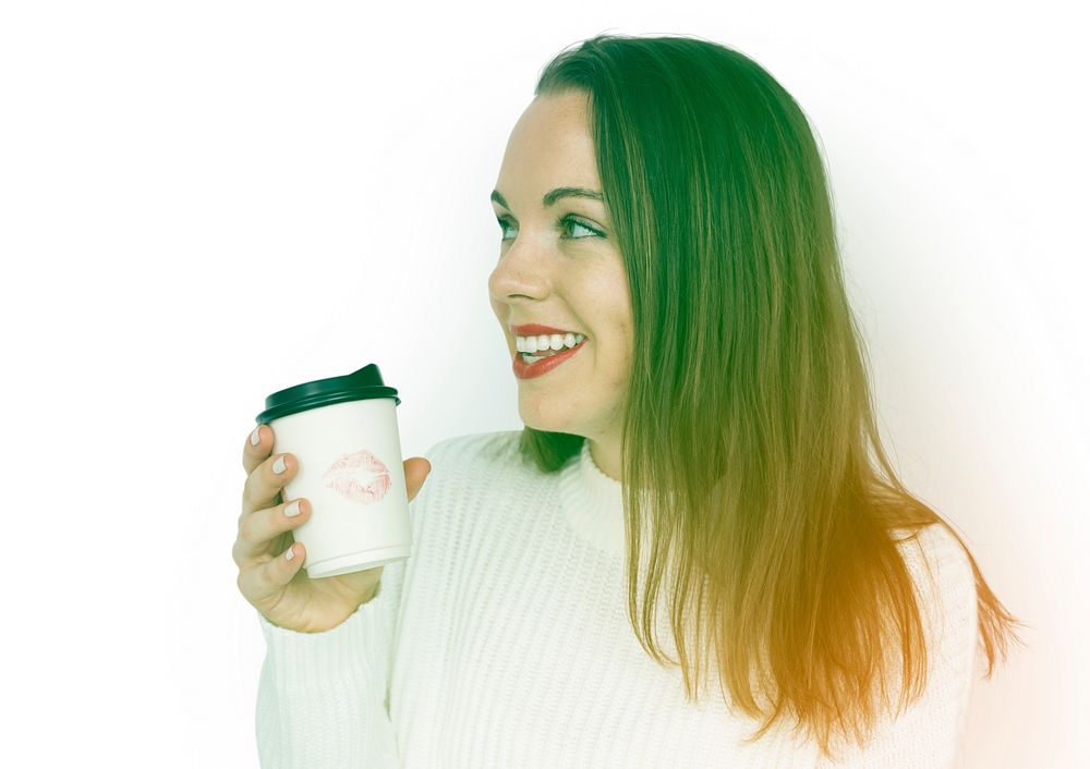 Happiness woman holding coffee cup with lipstick on it