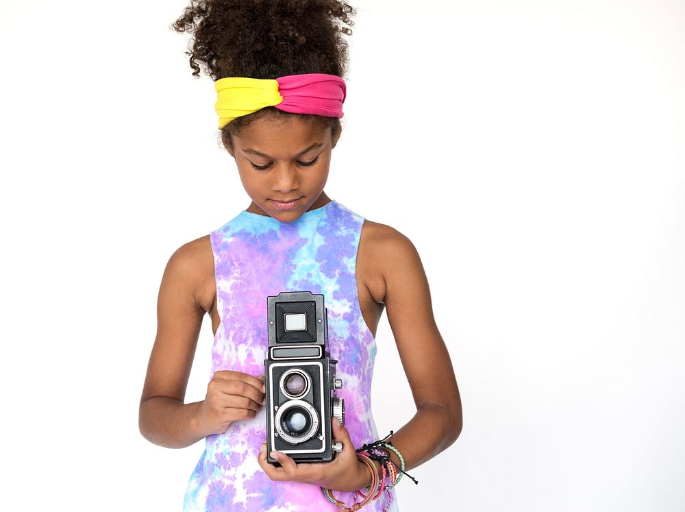 Little Girl Holding Classic Retro Styled Camera Studio Portrait