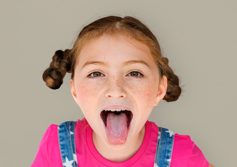 Little Girl Smiling Happiness Sticking Out Tongue Studio Portrait