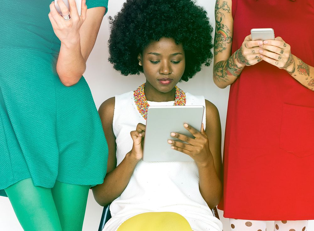 Group of women using digital devices sharing and connection