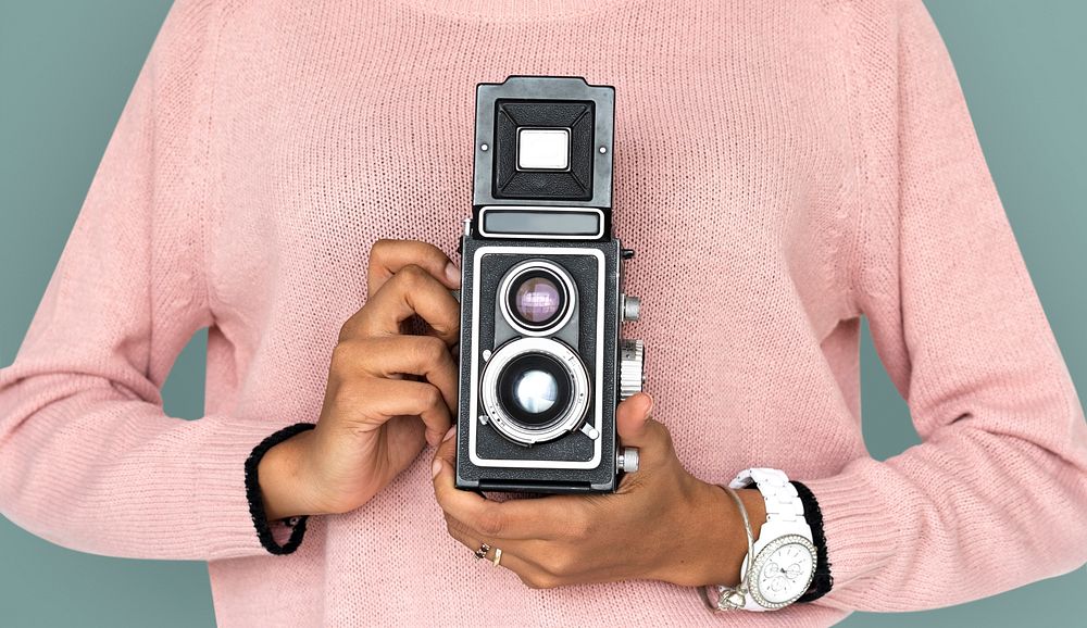 Girl Holding retro classic camera