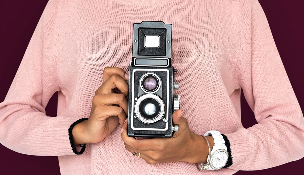 Girl Holding retro classic camera