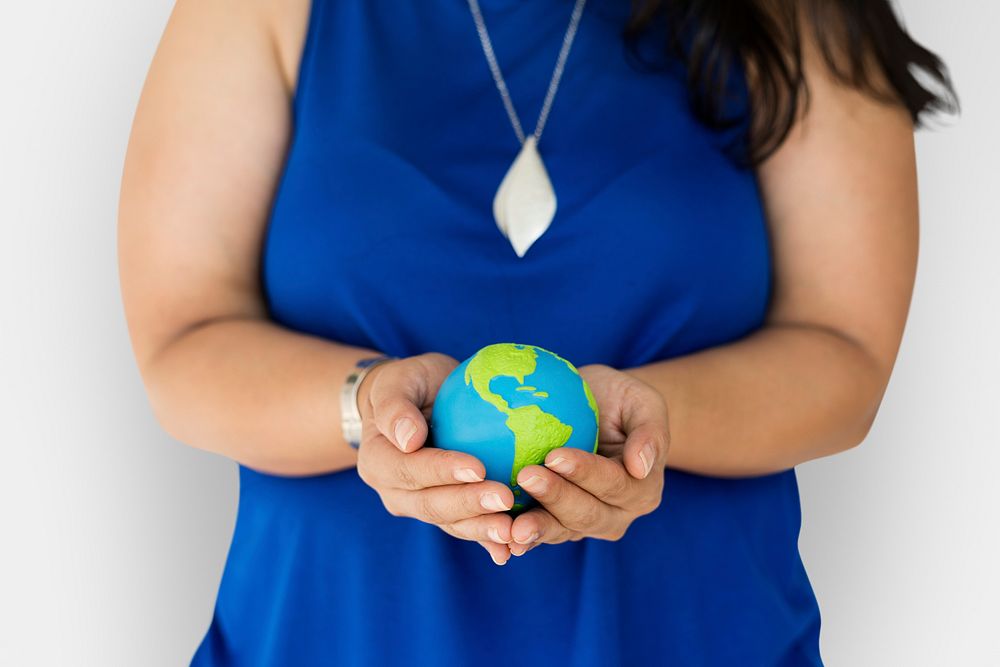 Woman holding global ball in her hands