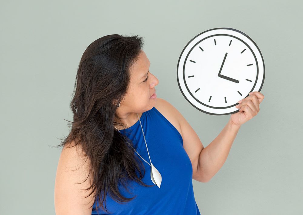 Woman checking the time on the clock