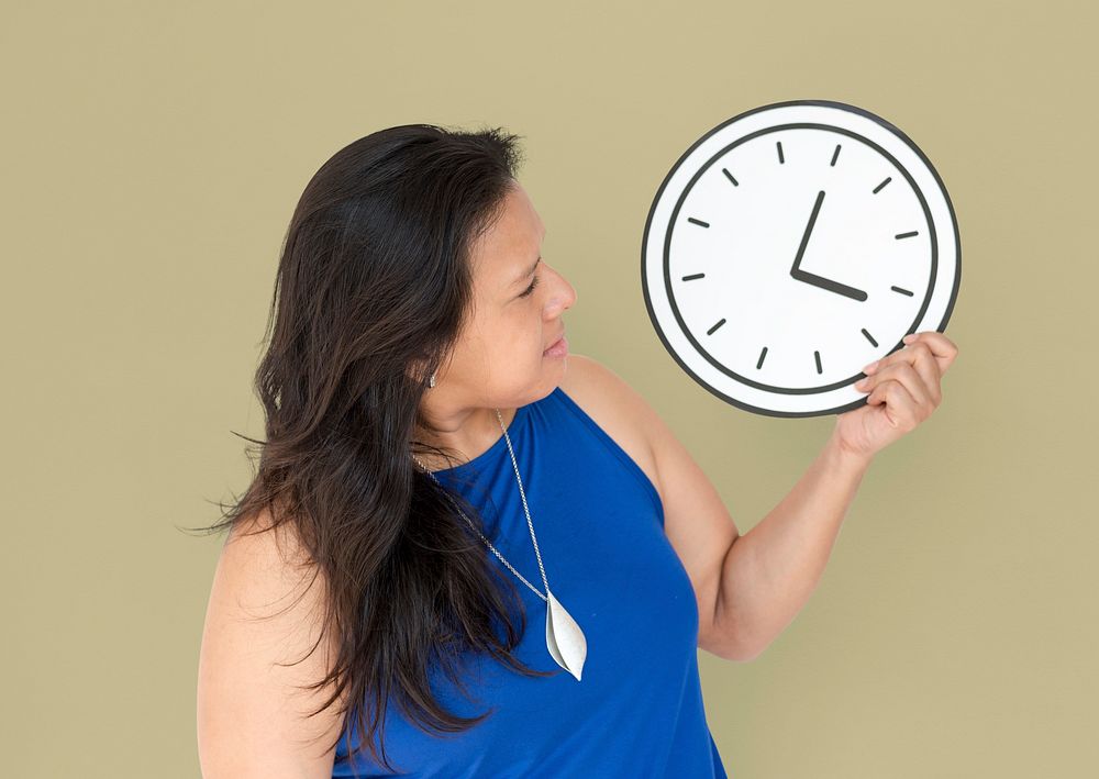 Woman checking the time on the clock
