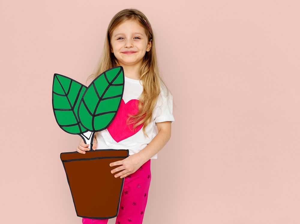 Little Girl Holding Papercraft Plant Smiling