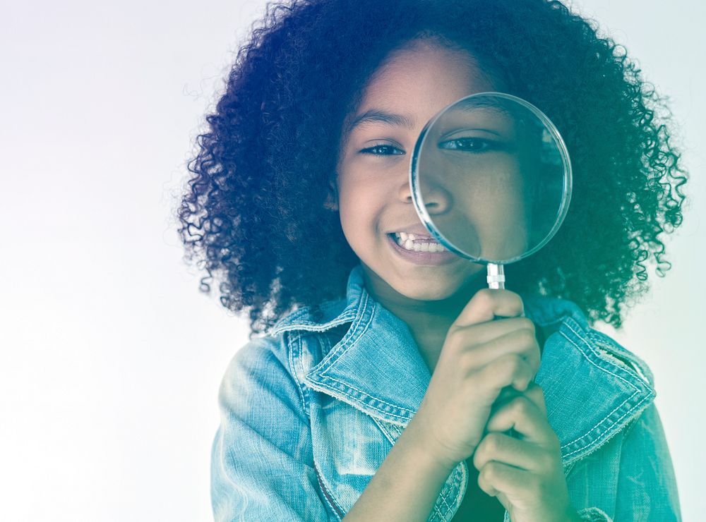 Kid using Magnifying Glass to explore