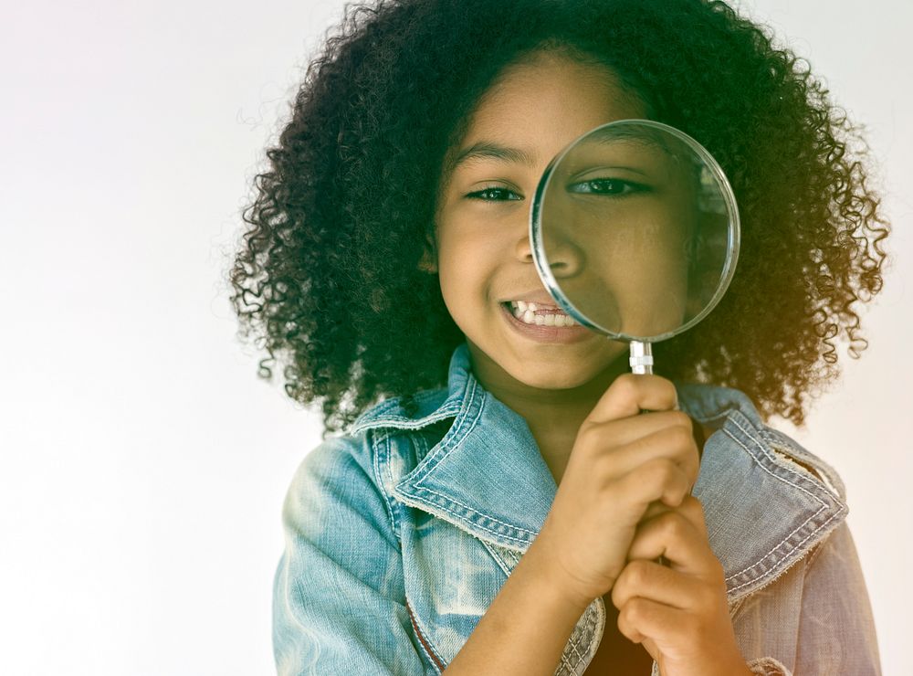 Kid using Magnifying Glass to explore