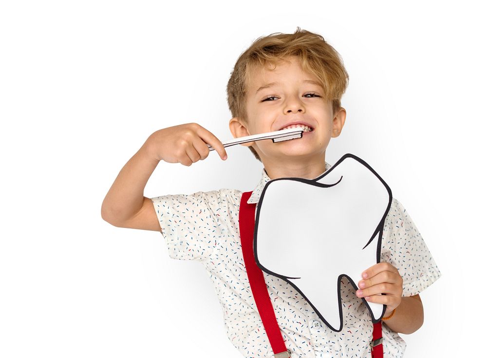 Little Boy Brushing Teeth Holding Papercraft Tooth