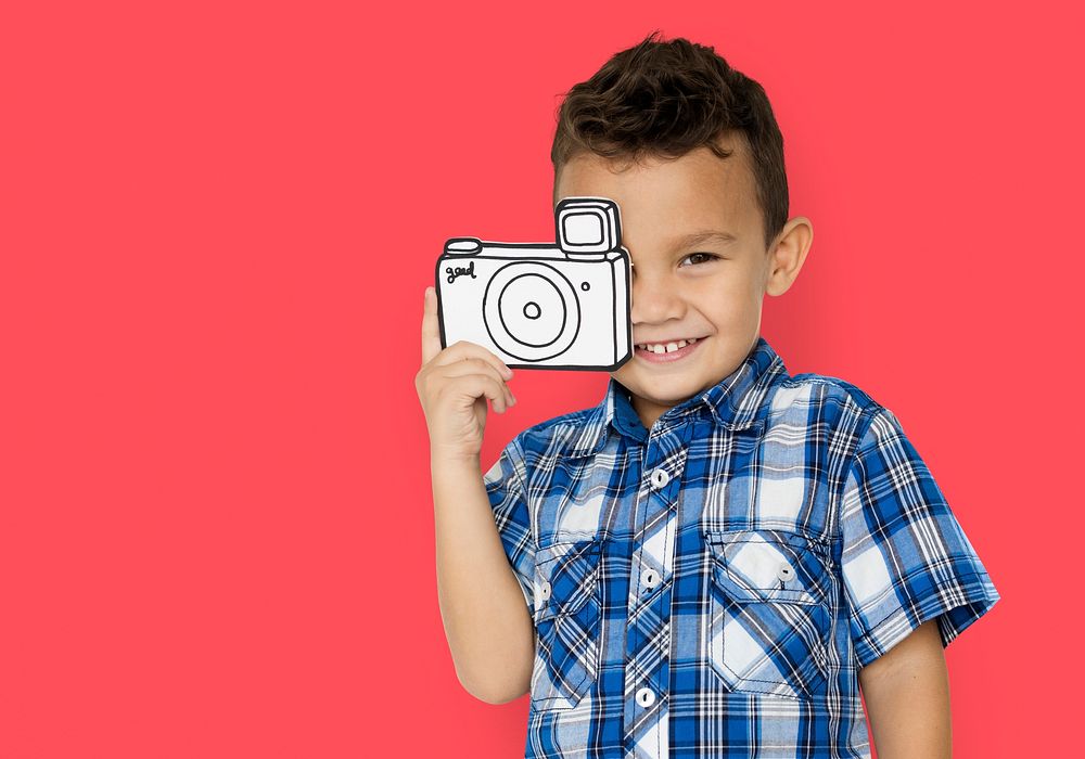 Boy taking a photo with a cardboard camera