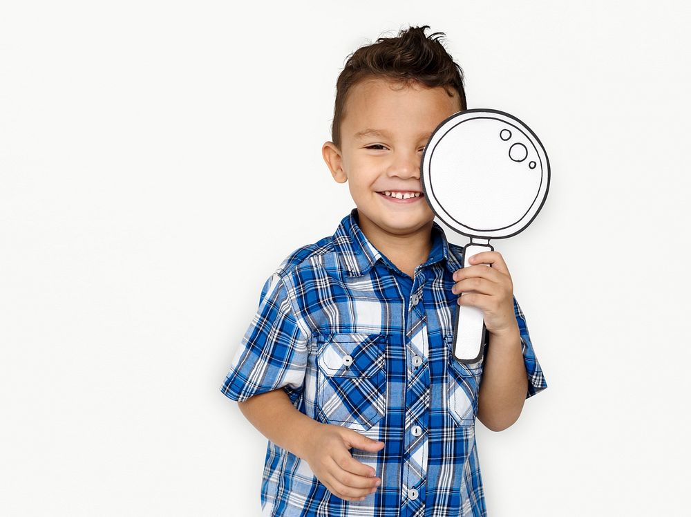 Boy using a paper magnifying glass