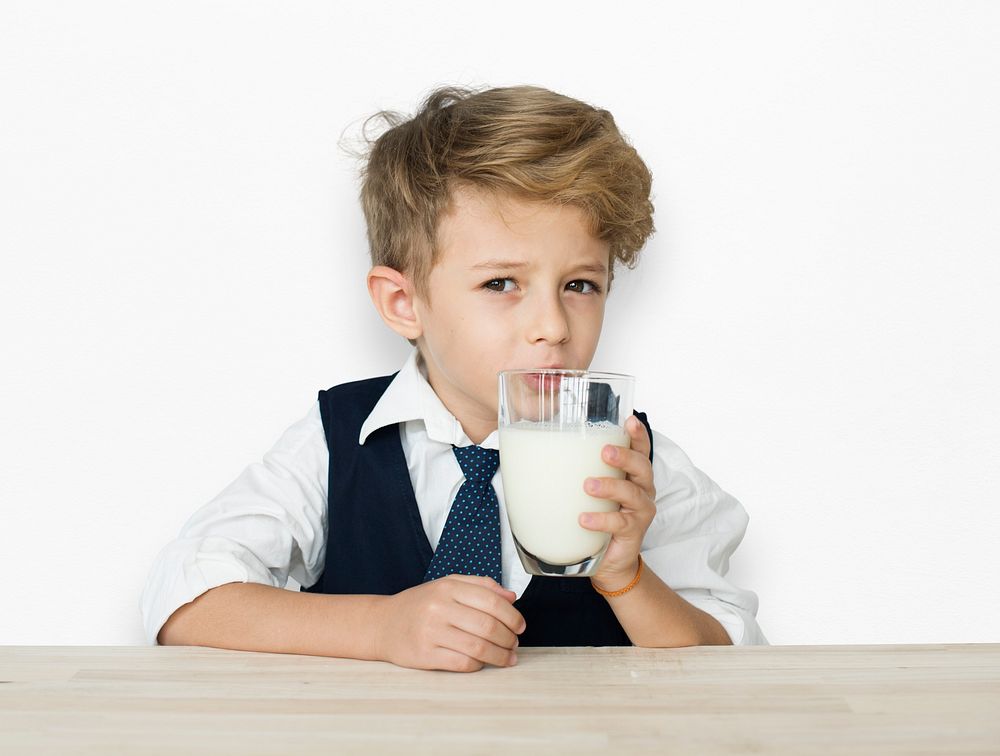 A Caucasian Boy Drinking Milk Background Studio Portrait