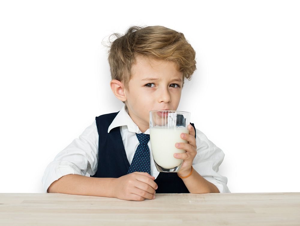 A Caucasian Boy Drinking Milk Background Studio Portrait