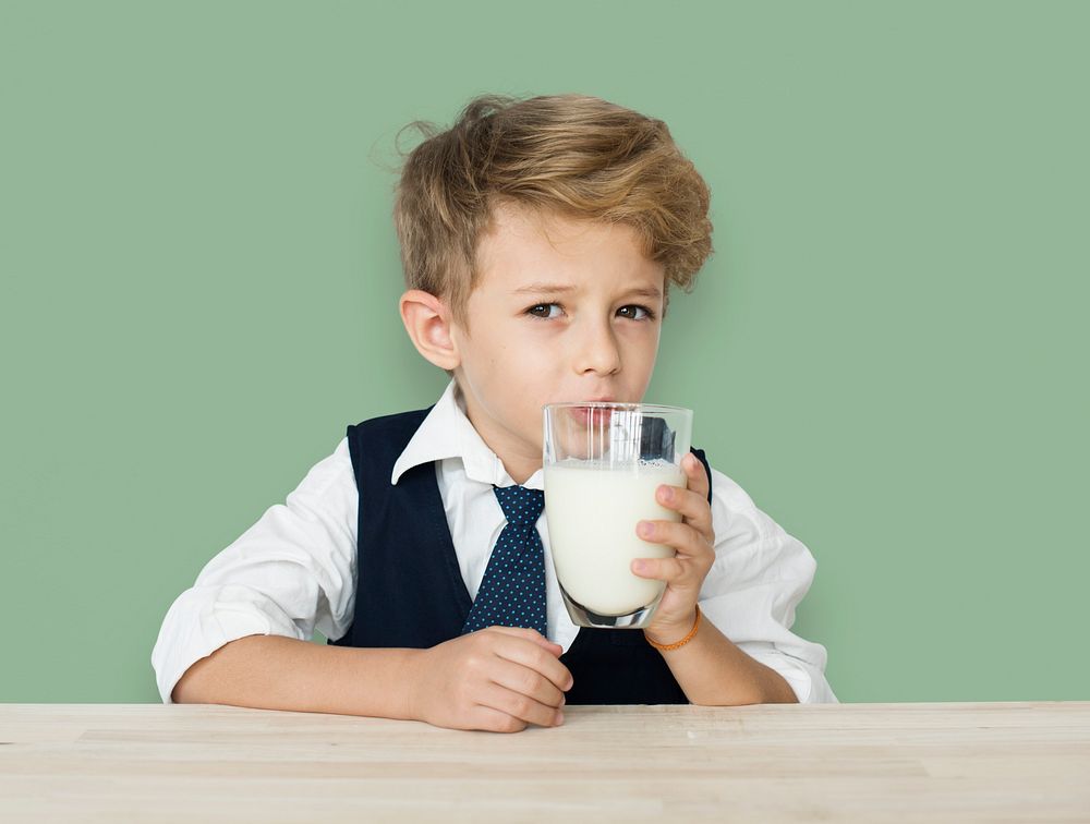 A Caucasian Boy Drinking Milk Background Studio Portrait