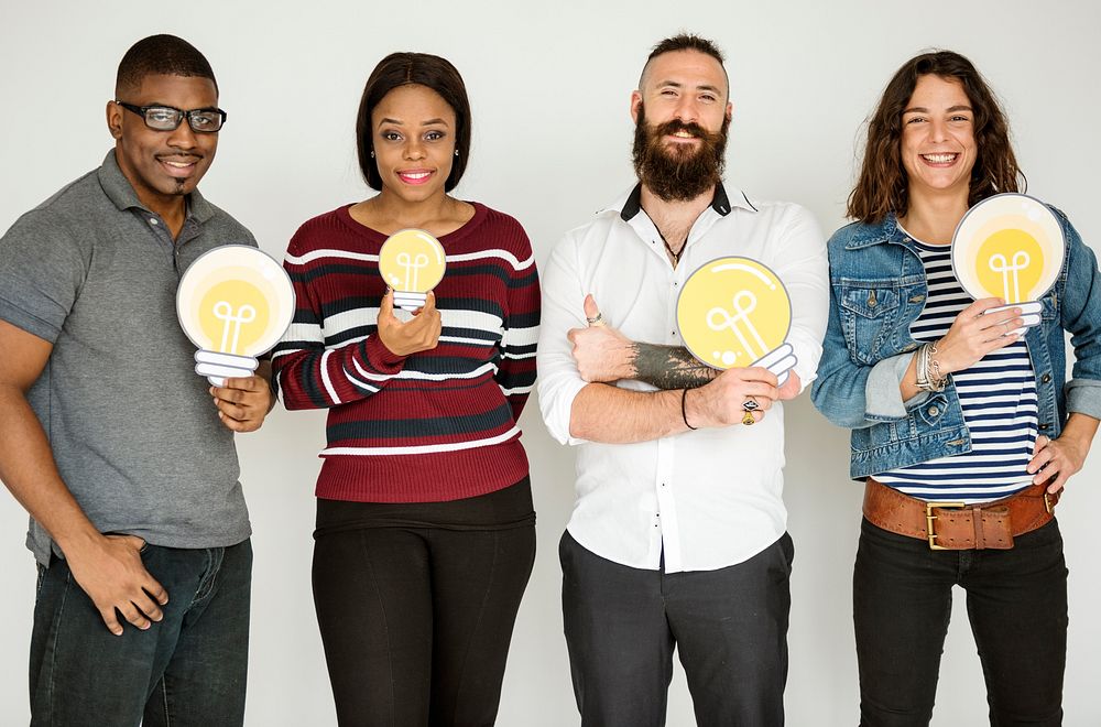 Group of People Holding Lightbulb Concept