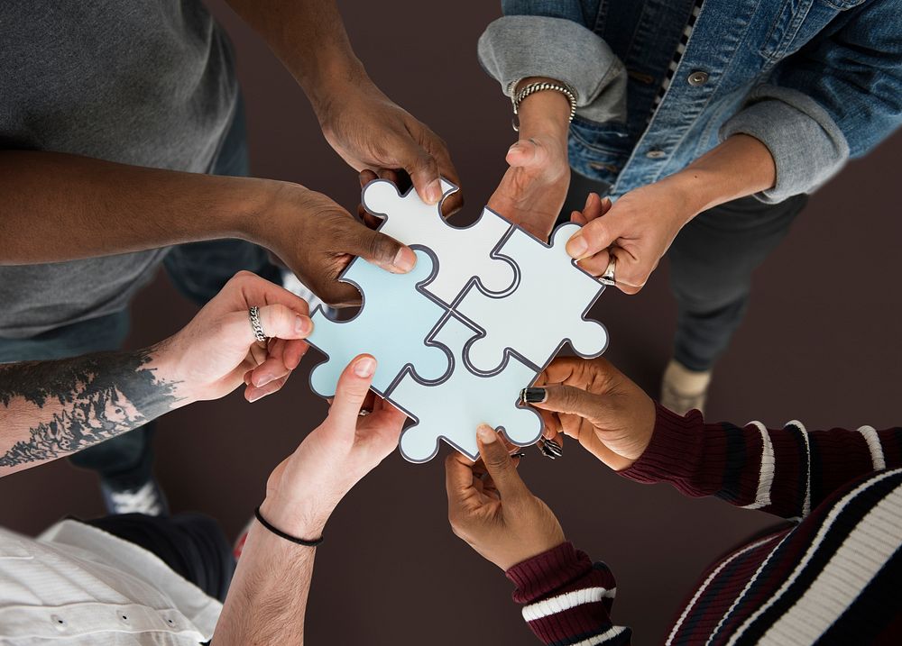 Group of people Holding Paper Jigsaw Puzzle