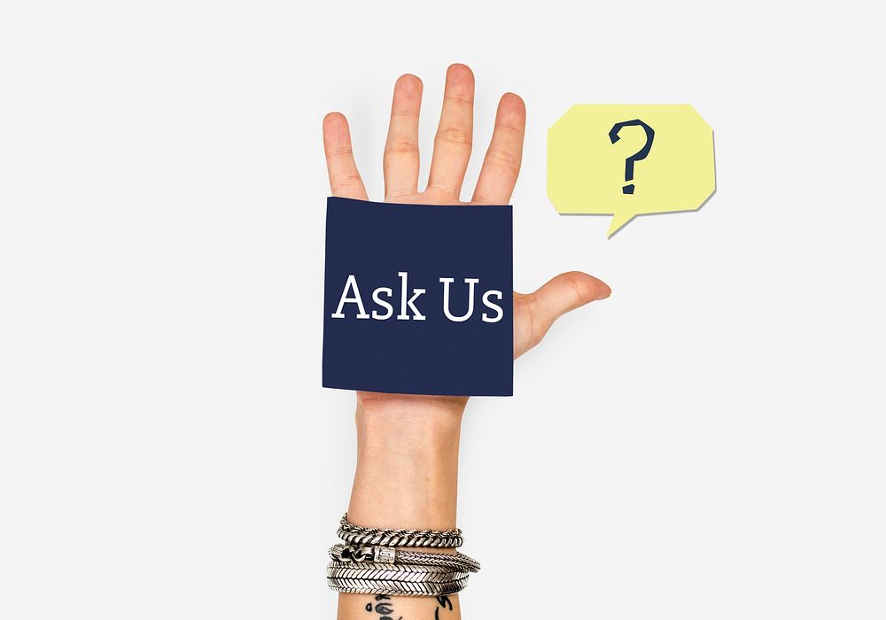 Woman holding a note with "Ask Us"