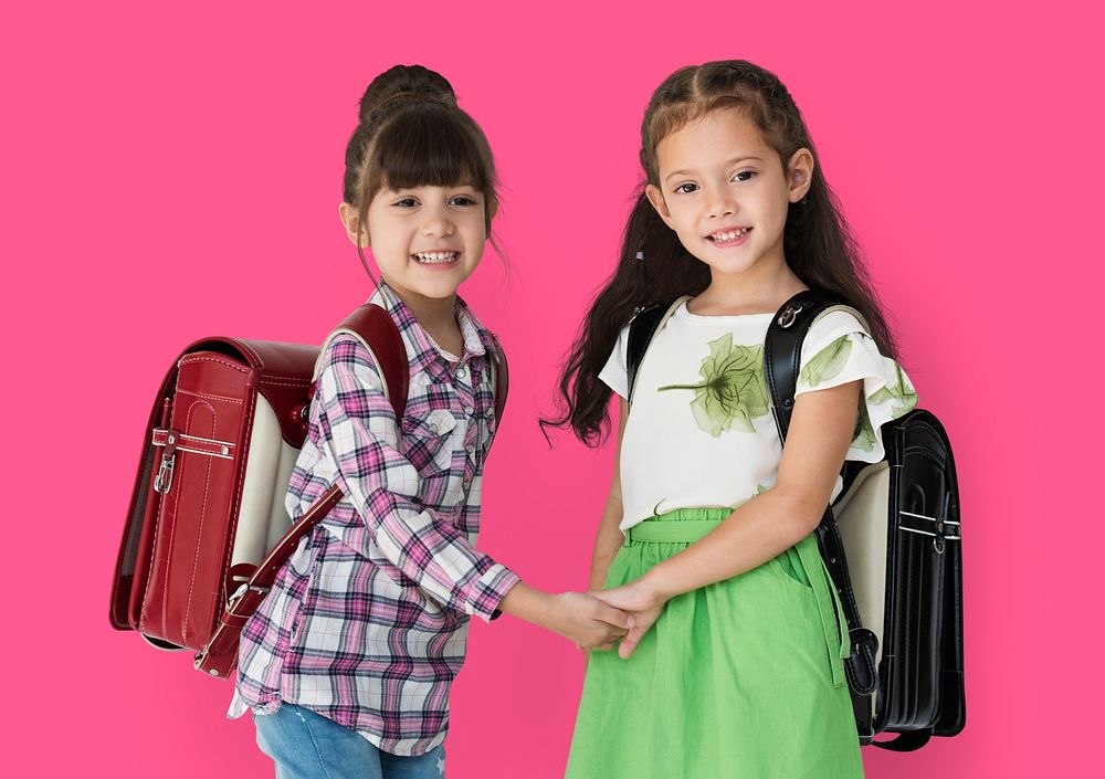 Two girls with a backpack