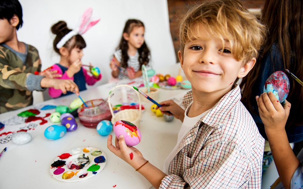 A group of primary schoolers colouring easter eggs