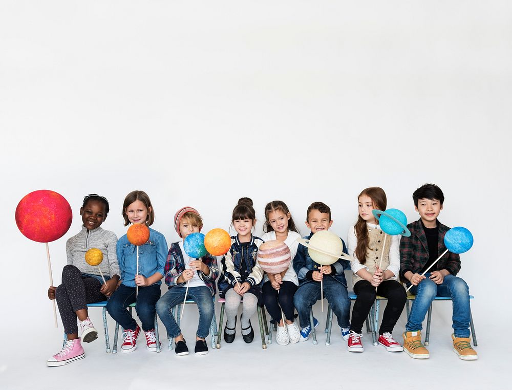 Group of Kids Holding Papercraft Galaxy Symbol on White Blackground