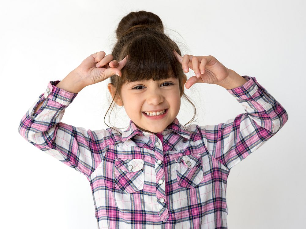Little cute and adorable girl smiling studio portrait