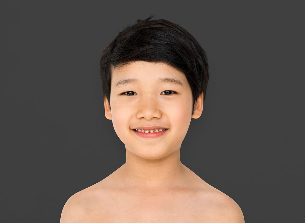 Young asian boy head and shoulder smiling portrait