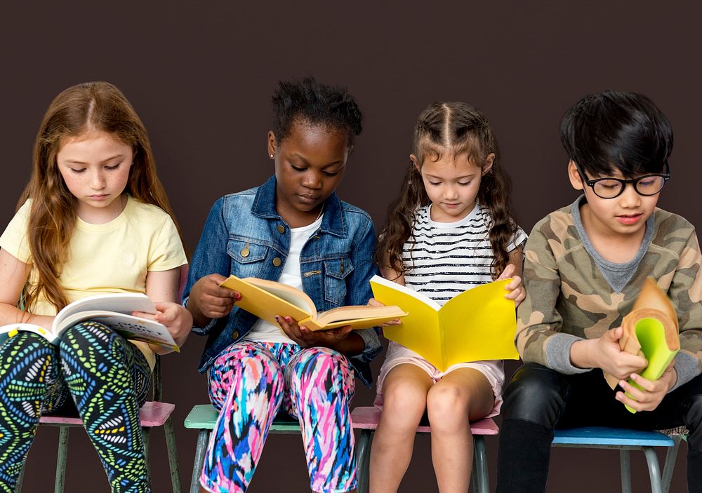 Group of children reading a book