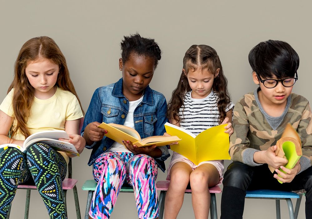 Group of children reading a book