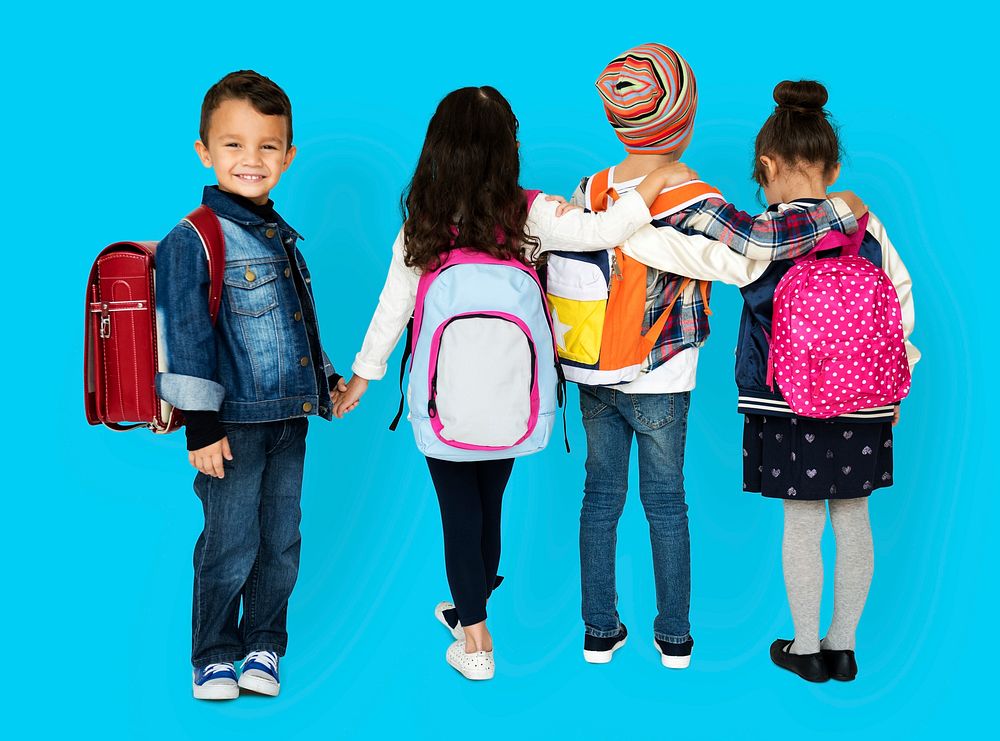 Rear view group of diverse kids wearing backpack