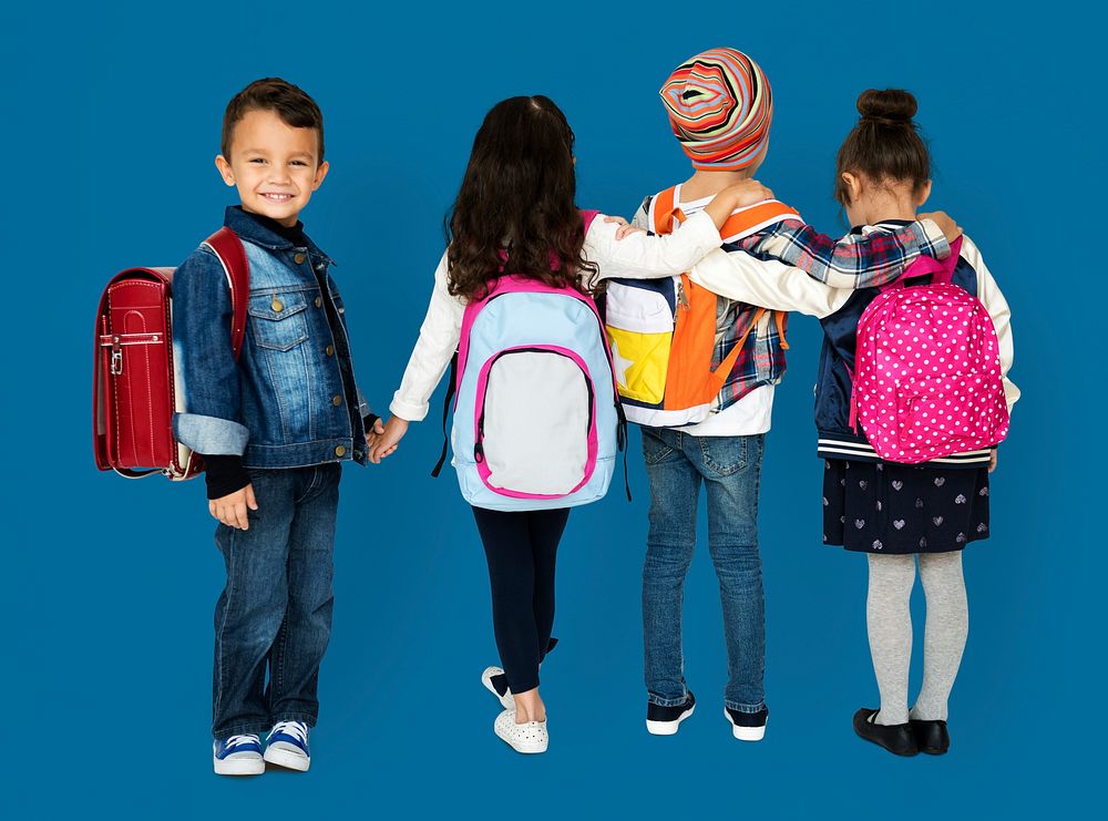 Rear view group of diverse kids wearing backpack