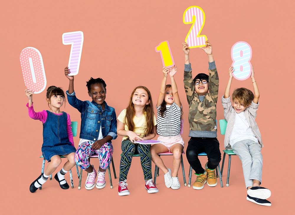A group of children are holding a number