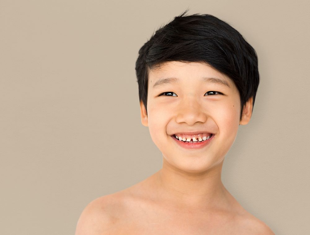 Smiling asian ethnicity boy in a shoot