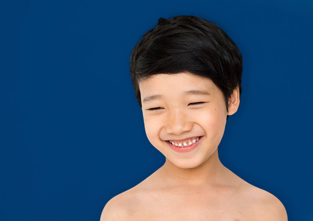 Smiling asian ethnicity boy in a shoot