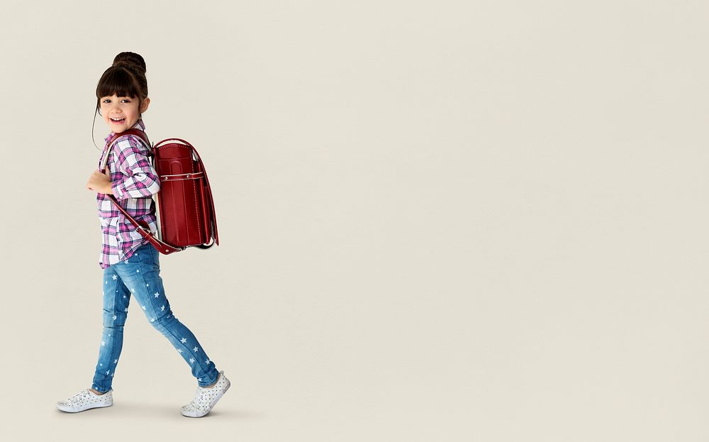 Young asian kid student with a backpack portrait