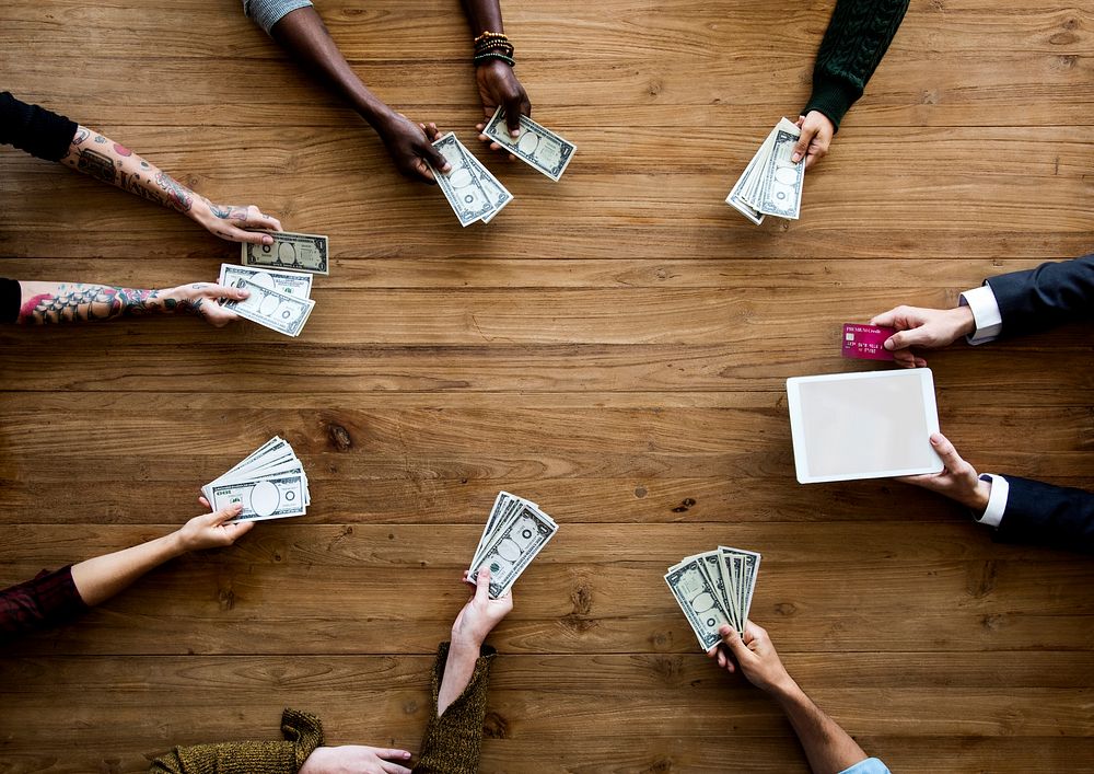 Diverse People Hands Hold Money Bill