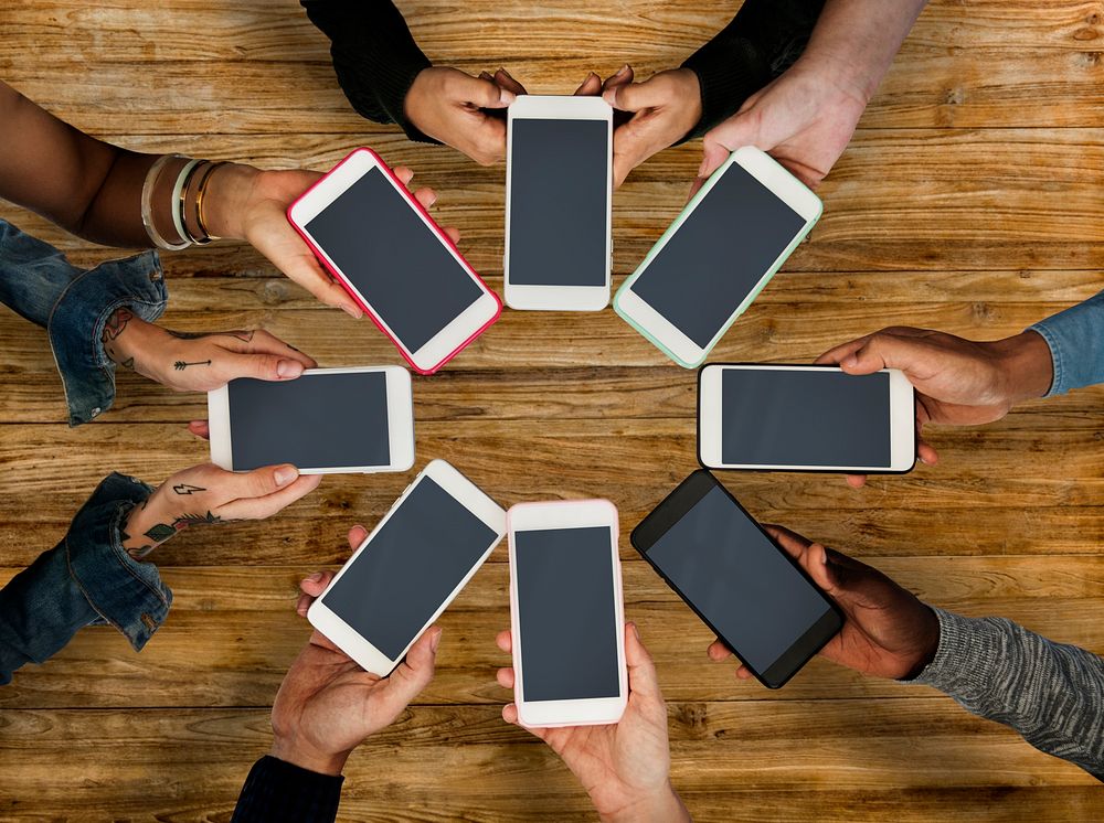 Group of people using mobile phone with blank screen