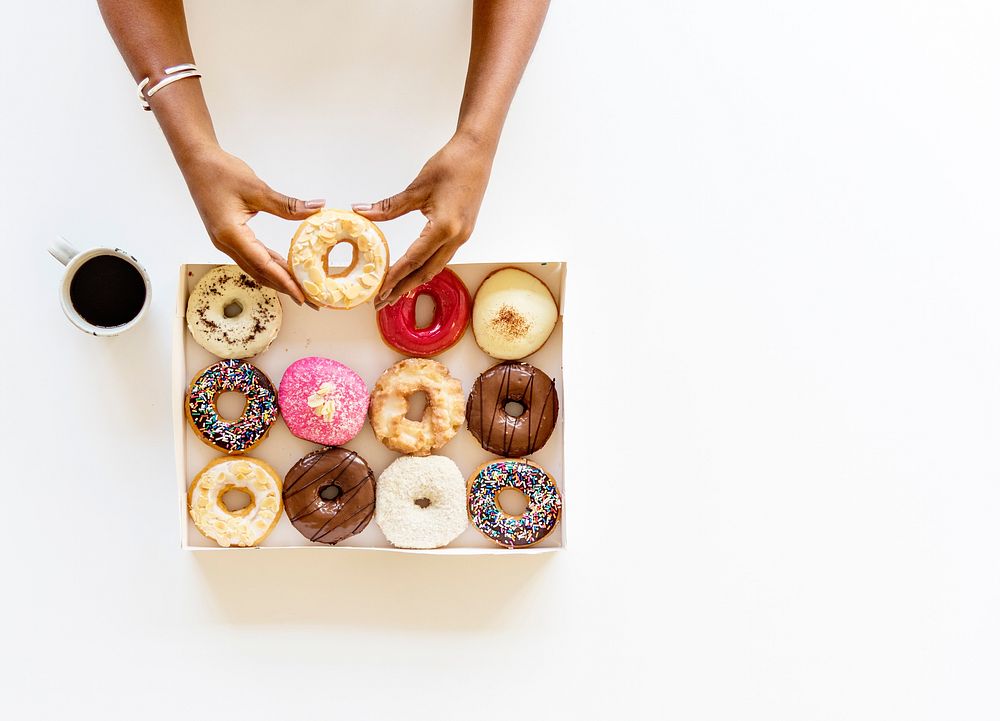 People Hands Hold for Doughnuts with Coffee
