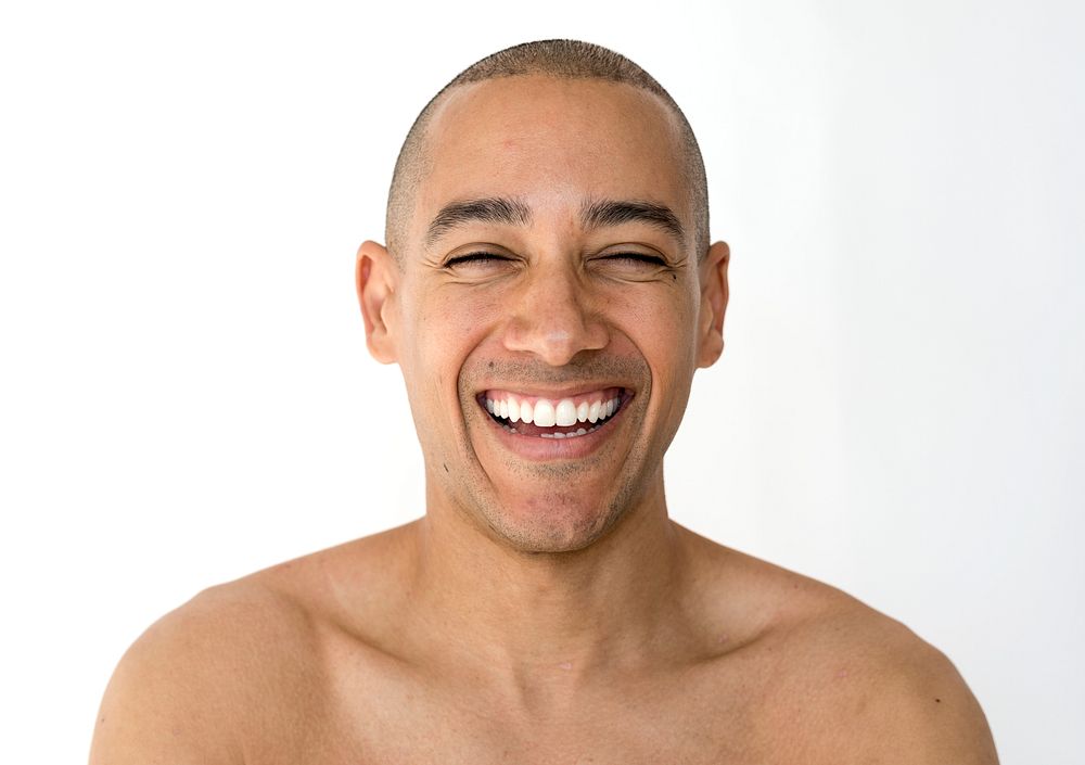 Smiling happiness man bare chest studio portrait