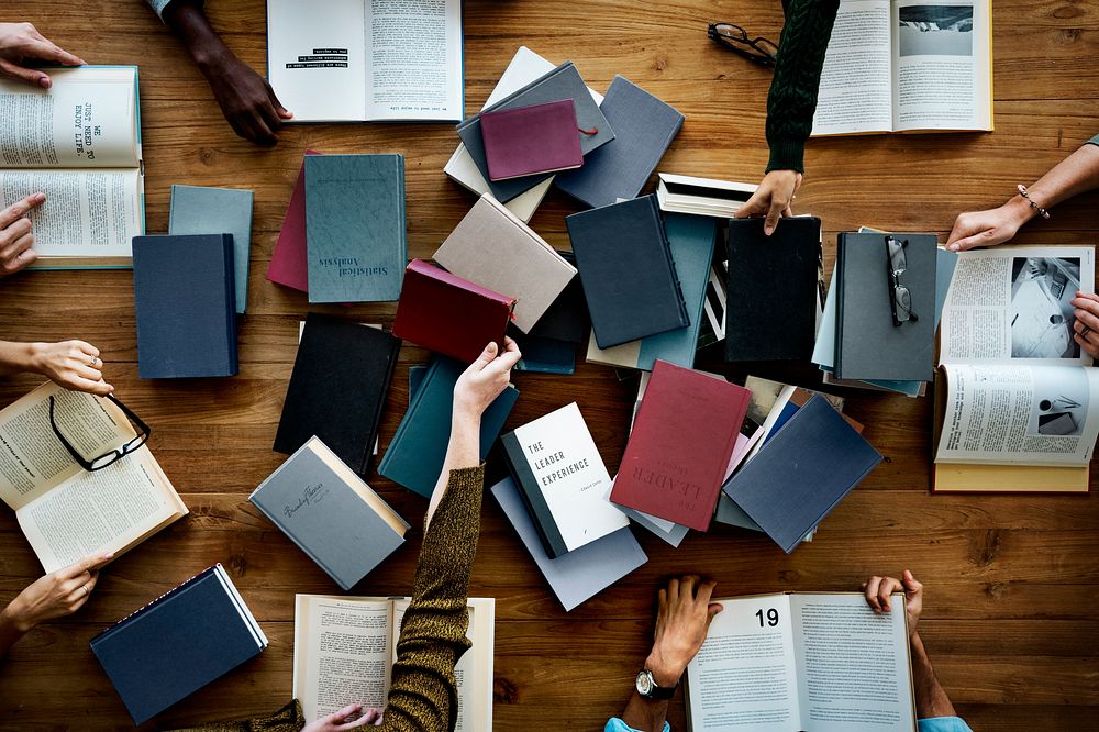 People Hands With Books Reading