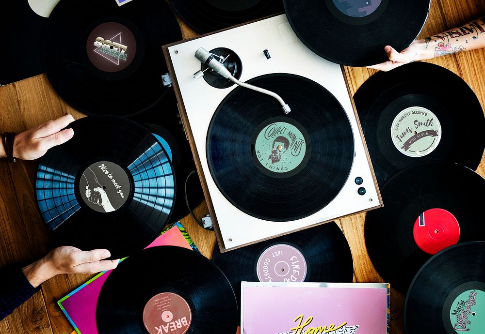 Music lovers with vinyl records