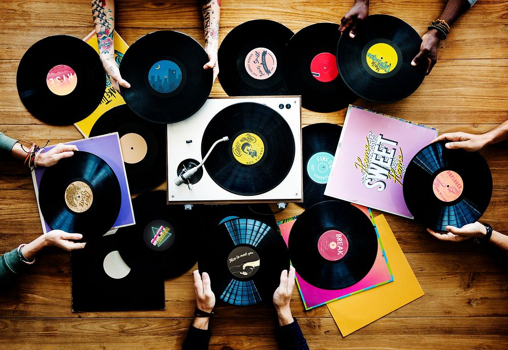 Hands with Vinyl Record Player Music