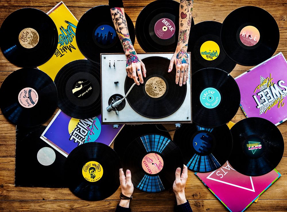 Music lovers with vinyl records