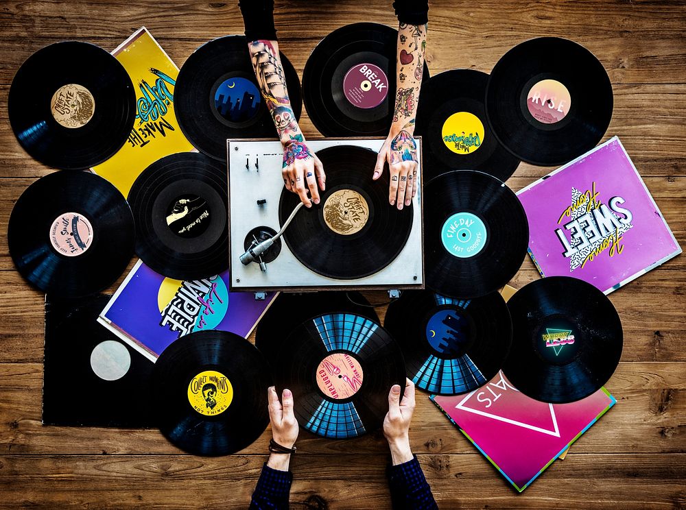 Hands with Vinyl Record Player Music